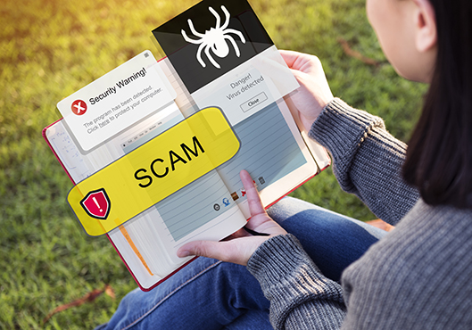 image of a college student looking at a book with the word scam over it