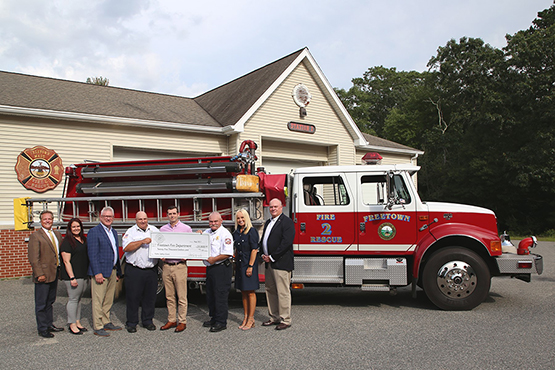 image of bank representatives with the Freetown fire department