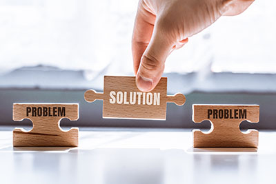 image of puzzle pieces showing problems and solutions