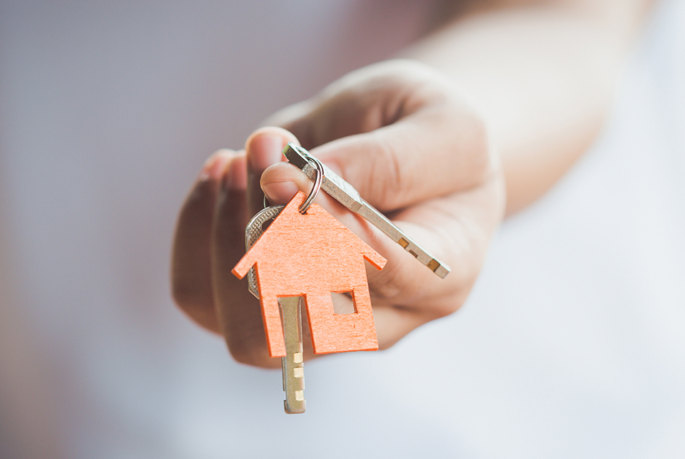 orange house keychain with keys