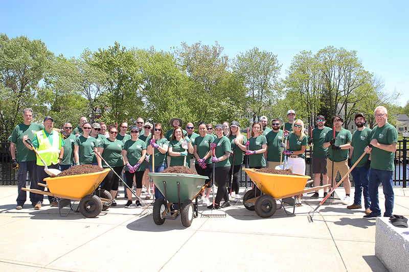 Bank employees volunteering for mulching project at Weir Park