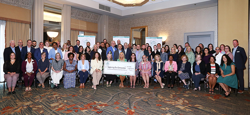 Group check presentation of $404,421 to 45 non-profit organizations