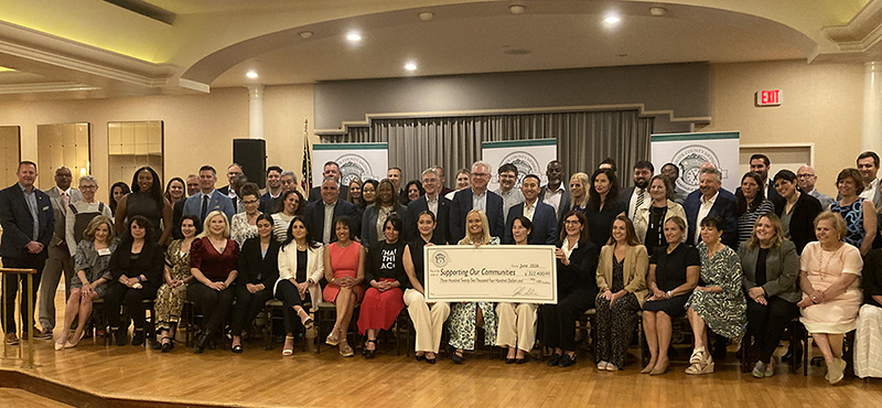 Group check presentation of $322,400 to 40 non-profit organizations 
